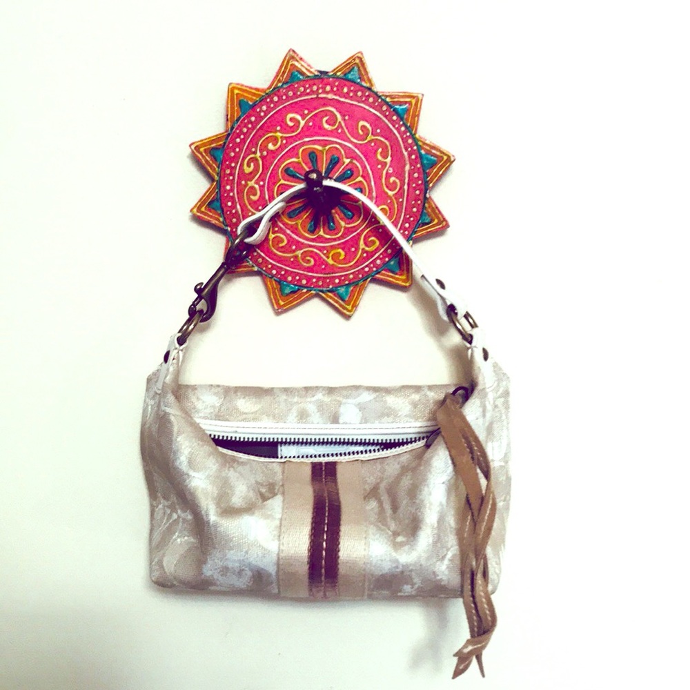 Gold beige tan coach clutch